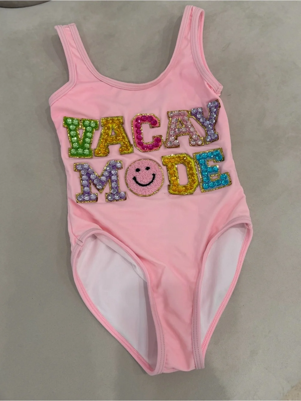 Kids Pink One-Piece Swimsuit with Sequin 'VACAY MODE' and pink shorts